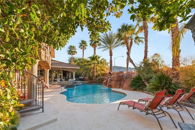 609 China Doll Pl, Henderson, NV 89012 - view of swimming pool featuring pool water feature and a patio