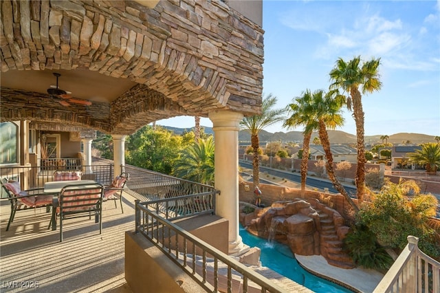 609 China Doll Pl, Henderson, NV 89012 - exterior space with a fenced in pool, ceiling fan, an outdoor hangout area, and a mountain view