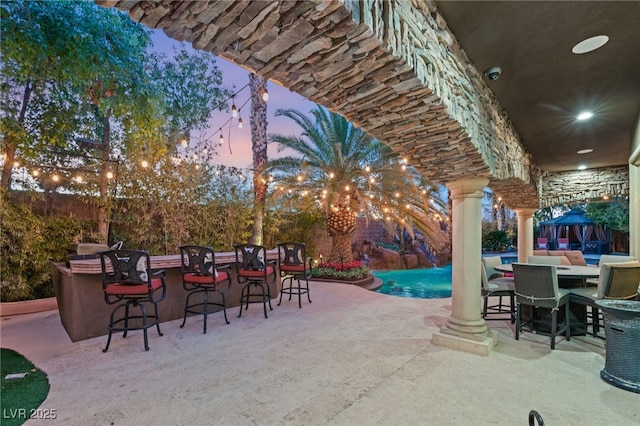 609 China Doll Pl, Henderson, NV 89012 - patio terrace at dusk featuring an outdoor bar