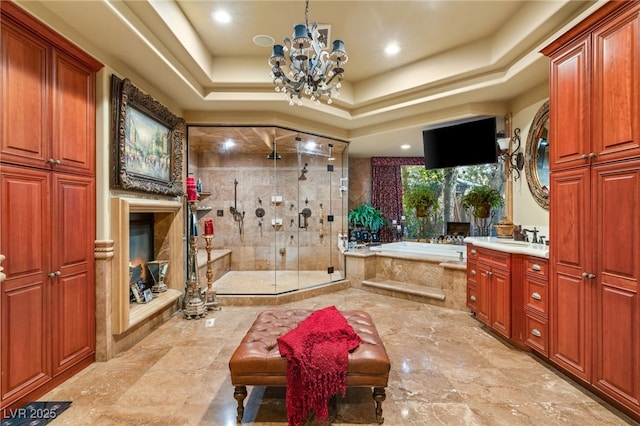 609 China Doll Pl, Henderson, NV 89012 - bathroom with vanity, a notable chandelier, shower with separate bathtub, and a raised ceiling