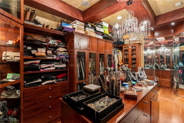 609 China Doll Pl, Henderson, NV 89012 - spacious closet with a notable chandelier and beam ceiling