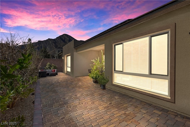 view of patio terrace at dusk