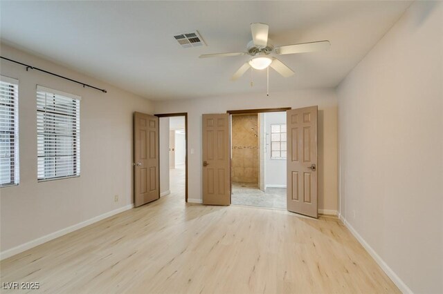 unfurnished bedroom with light hardwood / wood-style floors and ceiling fan