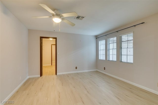 unfurnished room with ceiling fan and light hardwood / wood-style floors