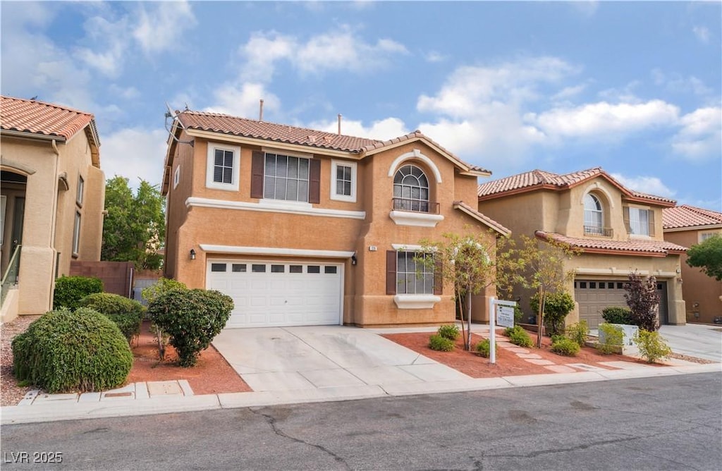 mediterranean / spanish-style house featuring a garage