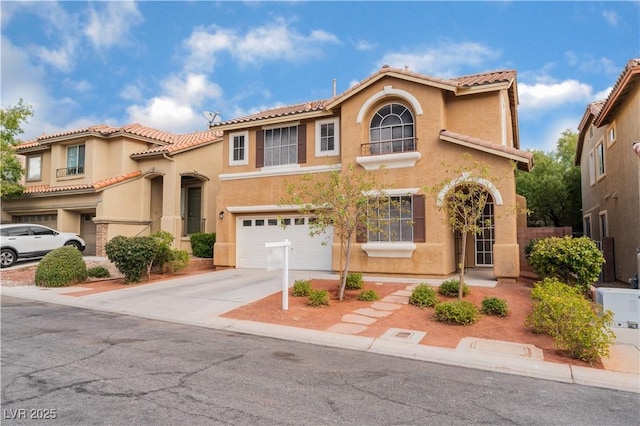 mediterranean / spanish-style house with a garage