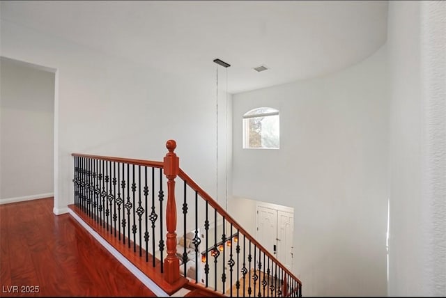 stairs with wood-type flooring