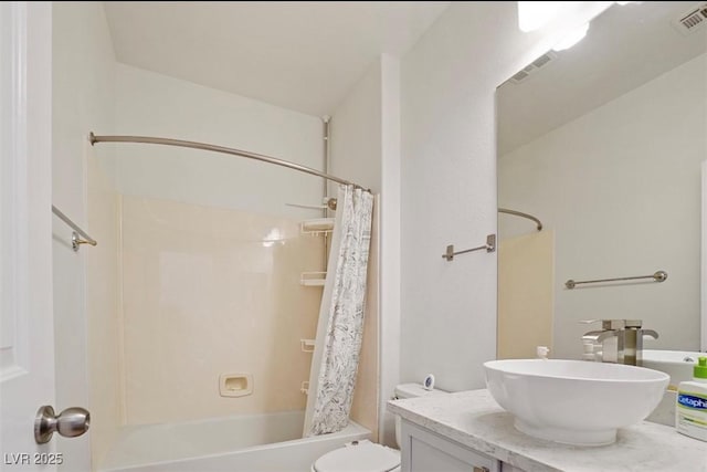 full bathroom with shower / bath combination with curtain, vanity, and toilet