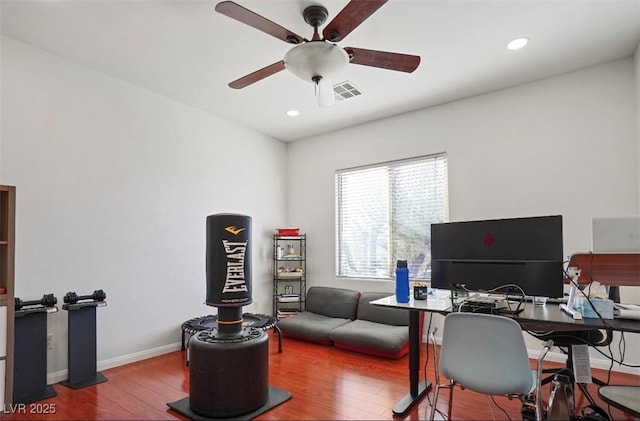 office space with wood-type flooring and ceiling fan