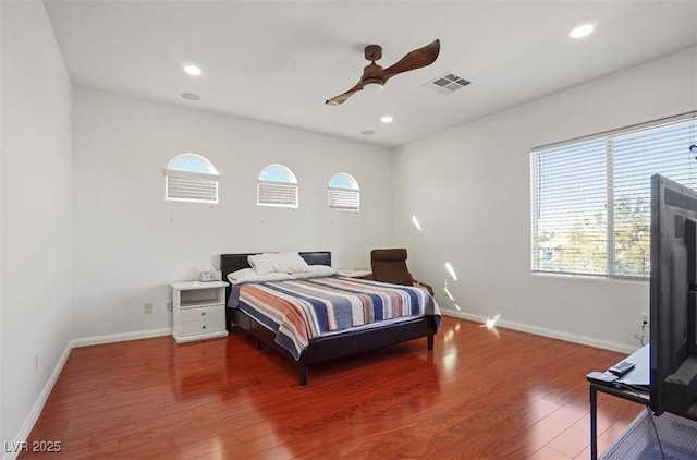 bedroom featuring wood-type flooring and ceiling fan