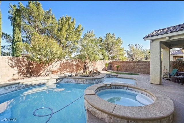 view of swimming pool featuring an in ground hot tub