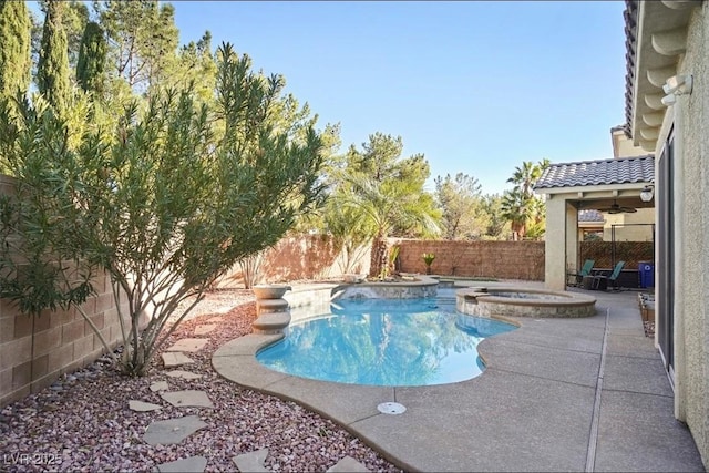 view of pool featuring an in ground hot tub and a patio area