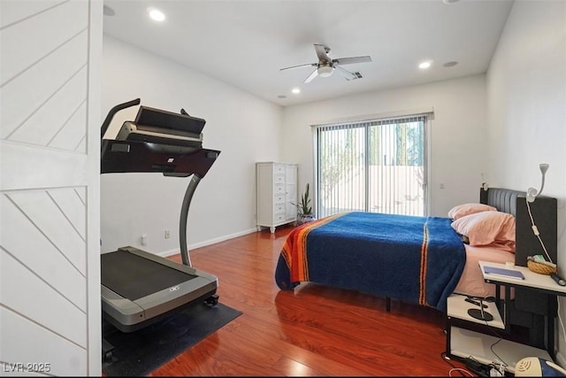 bedroom with dark hardwood / wood-style flooring, access to outside, and ceiling fan