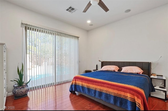 bedroom featuring wood-type flooring, access to exterior, and ceiling fan