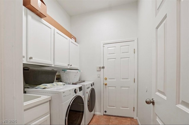 laundry room featuring separate washer and dryer, light tile patterned floors, and cabinets