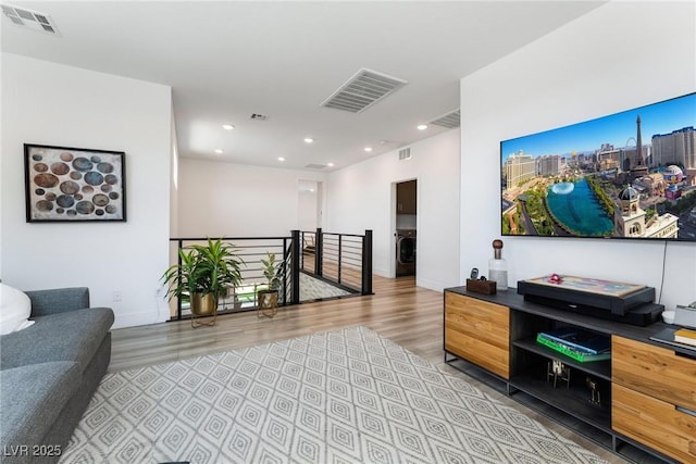 interior space with washer / clothes dryer and light wood-type flooring