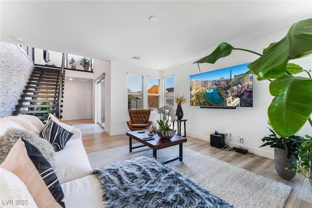 living room with light hardwood / wood-style floors