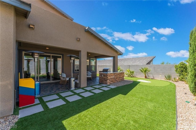 view of yard with area for grilling and a patio area