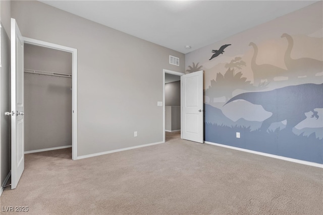 unfurnished bedroom featuring a closet, carpet, visible vents, and baseboards