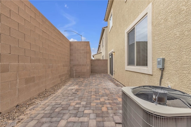 view of patio / terrace featuring a fenced backyard and central AC