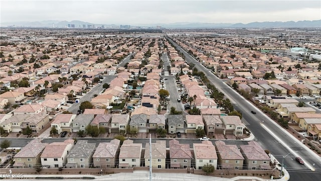 drone / aerial view featuring a residential view and a mountain view