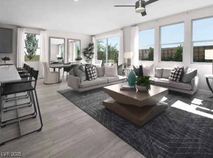 sunroom with a wealth of natural light and ceiling fan