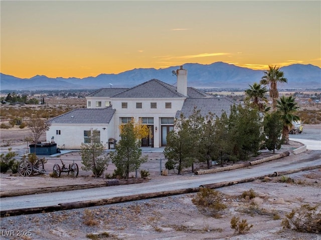 view of front facade featuring a mountain view