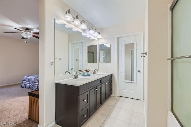 bathroom featuring tile patterned flooring, vanity, and ceiling fan