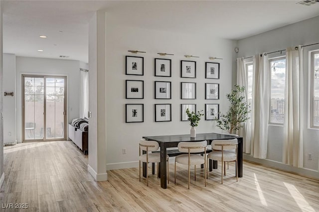 dining space featuring light hardwood / wood-style flooring