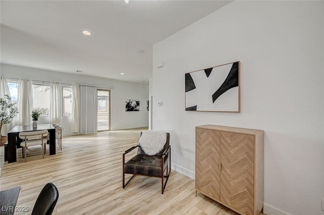 sitting room featuring light hardwood / wood-style floors