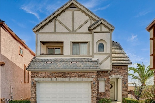 tudor-style house with a garage