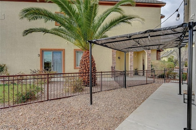 view of home's exterior featuring a pergola