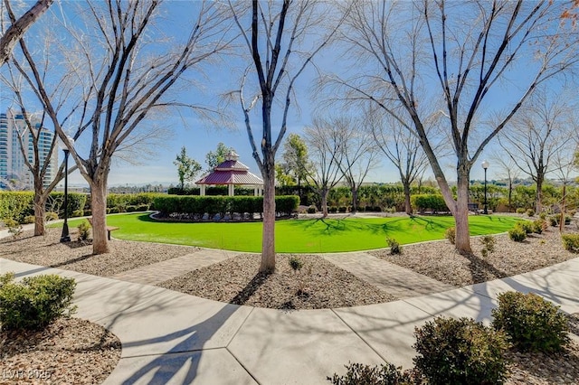 view of property's community with a gazebo and a lawn