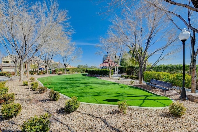 view of property's community with a gazebo and a lawn