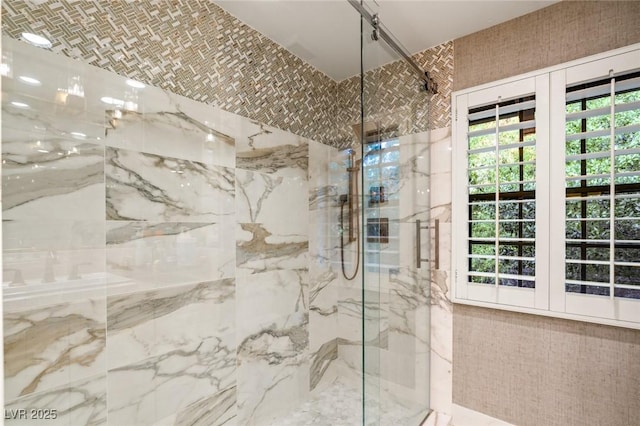 bathroom with a shower with shower door