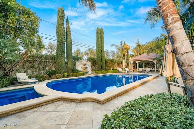 view of pool featuring a gazebo and a patio area