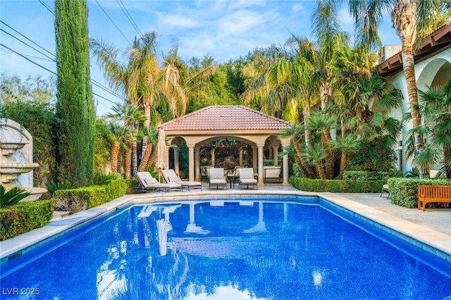 view of swimming pool with a gazebo and a patio area