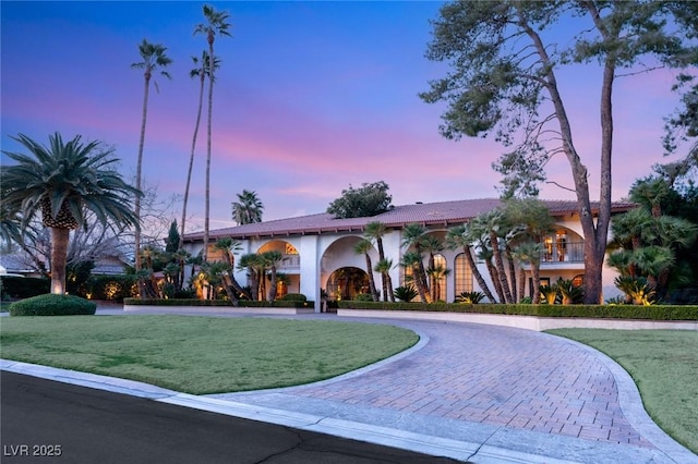 view of outdoor building at dusk