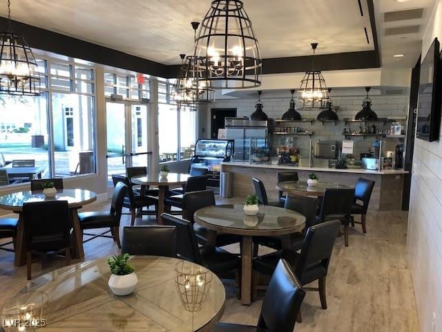 dining area with light hardwood / wood-style floors