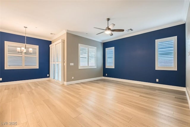 spare room featuring ornamental molding, ceiling fan with notable chandelier, and light hardwood / wood-style flooring