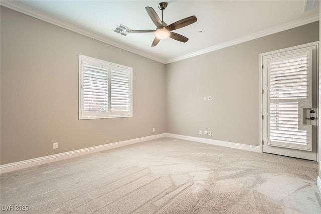 carpeted empty room featuring crown molding and ceiling fan