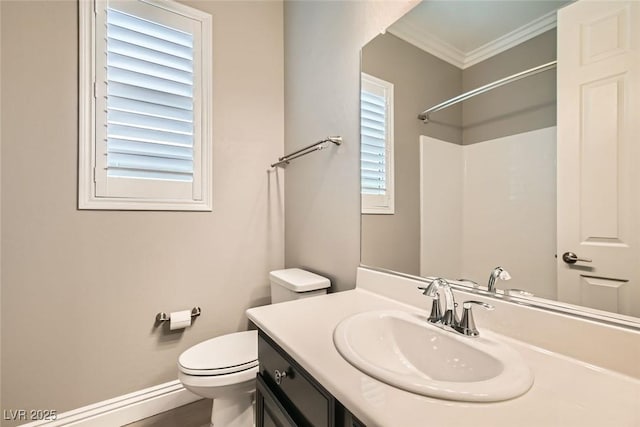 bathroom featuring vanity, ornamental molding, and toilet