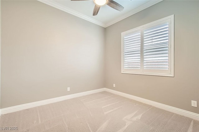 carpeted empty room featuring ceiling fan and ornamental molding