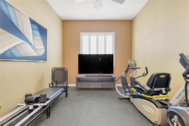 exercise room with ceiling fan