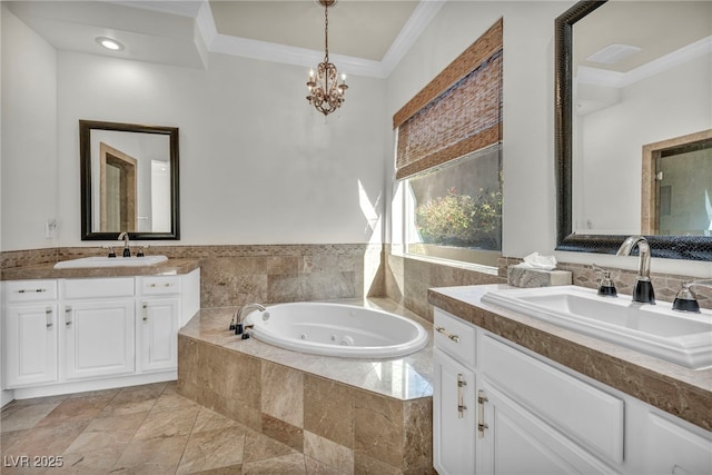 bathroom featuring ornamental molding, tiled bath, vanity, and a notable chandelier