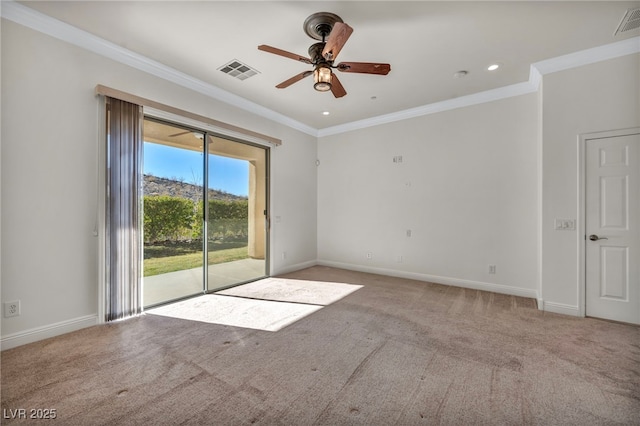 carpeted empty room featuring ornamental molding and ceiling fan