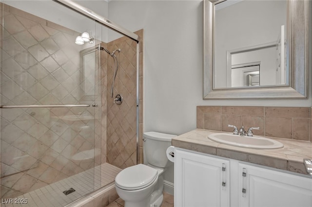 bathroom with walk in shower, vanity, toilet, and backsplash