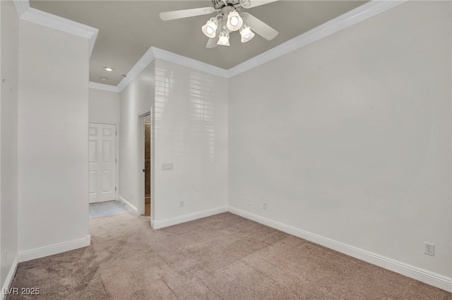 unfurnished room with ornamental molding, light colored carpet, and ceiling fan