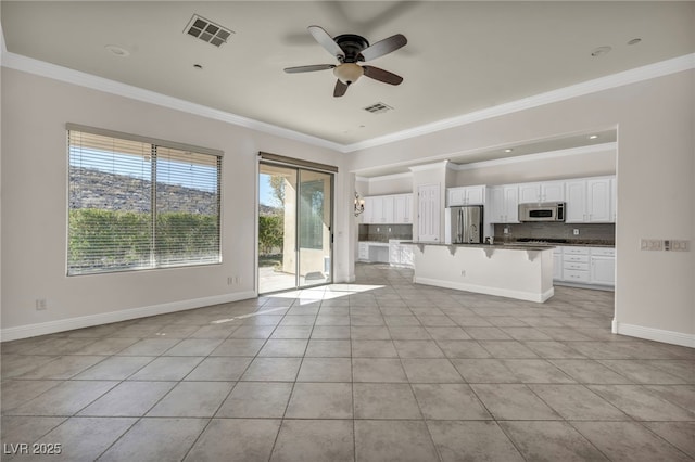 unfurnished living room with crown molding, ceiling fan, and light tile patterned flooring