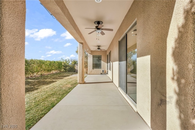 view of patio featuring ceiling fan